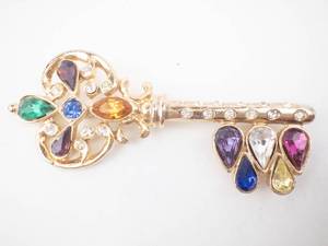 lot 175 image: Key-Shaped Gold-Tone Brooch with Multicolor Gemstones