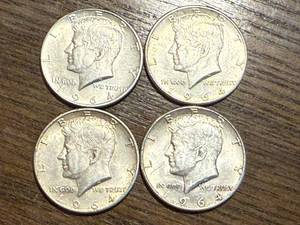 lot 16 image: 4 - 1964 Kennedy Half Dollars