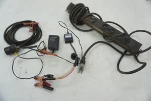 lot 84 image: Surge protector, extension cord needs end, Cen-tech automatic battery float charger