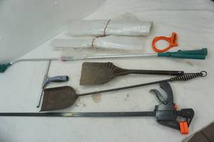 lot 252 image: Plastic Sheeting, VintageAntique Fireplace Shovel and Scoop, Long Wood Clamp, Cable Cuff, Watering Attachment, Squeegee (5 gallon bucket included)