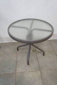 lot 254 image: Small Outdoor Patio Table. Glass and Metal. 20.5 diameter by 18 tall