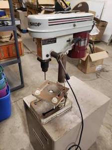 lot 14 image: Tool shop drill press mounted to a metal cabinet