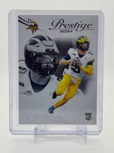 lot 108 image: 2024 Panini Prestige J.J. McCarthy Rookie Card Wearing Michigan Wolverines Uniform