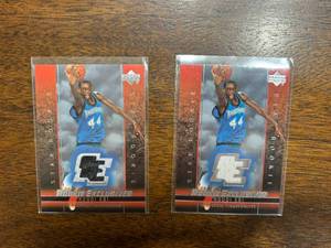lot 253 image: 2004 Uppder Deck Rookie Exclusives 2-Card Lot, Ndudi Ebi Minnesota Timberwolves Jersey Cards, Different Color Jersey Pieces