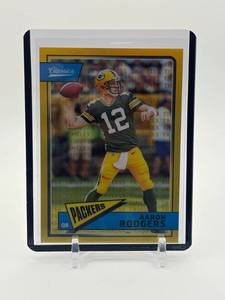 lot 444 image: 2018 Panini Classics Aaron Rodgers Timeless Tributes Premium Gold Serial #d 65