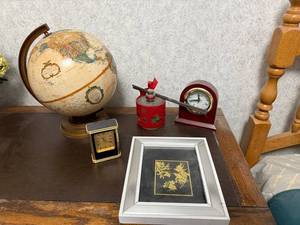 lot 82 image: Decorative Desk Lot with Globe, Clocks, Oil Diffuser, and Framed Art