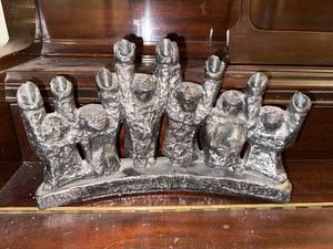 lot 98 image: Vintage Black Cast Metal Menorah Candle Holder with Figures
