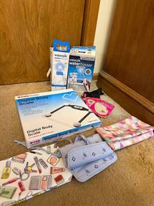 lot 66 image: Group of Waterpik Water Flossers, CVS Digital Body Scale, Cosmetic Bags, and Accessories
