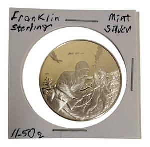 lot 27 image: Franklin Mint Tribute Coin World War II Veterans 11.50 grams of sterling silver proof coin.
