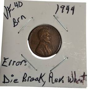 lot 83 image: 1944 Wheat Penny  VF-40 Brown  with a Die Break Error on the Reverse Side.