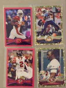 lot 172 image: Four NFL football Trading Cards Featuring Different Players.