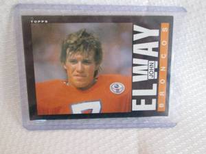 lot 411 image: 1985 Topps John Elway Card...
