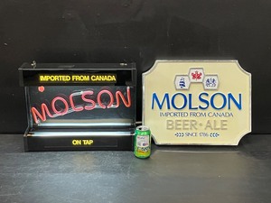 lot 128 image: Lot of 2, Molson neon and fluorescent sign, and Molson plastic sign