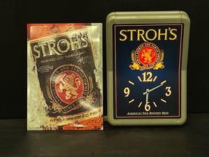 lot 138 image: Lot of 2 Strohs light up clock and Strohs tin tacker