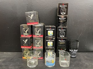 lot 197 image: Large lot of whiskey tumblers Bacardi Black Stars & Stripes Americas Cup sailing, Black Velvet and Jack Daniels plastic cups