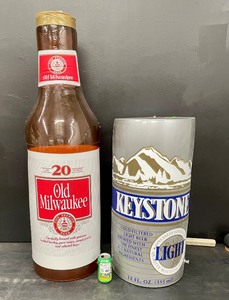 lot 213 image: Inflatable Old Milwaukee beer bottle and Keystone Beer can, Lot of 2