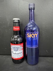 lot 163 image: Lot of 2 glass display bottles Budweiser and Skyy Vodka