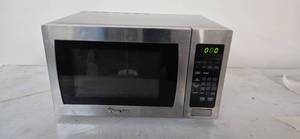 lot 9 image: Magic Chef Microwave with a dimension of 14L x19W x 10H Used from a shutdown hotel