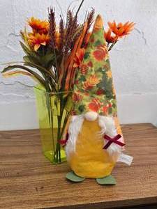 lot 13 image: Fall gnome and vase with flowers