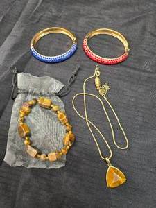 lot 94 image: Necklace, 2 bracelets, and a tigers eye bracelet