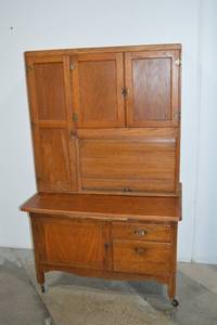 lot 22 image: Antique Oak Hoosier Kitchen Cabinet with Original Interior Charts