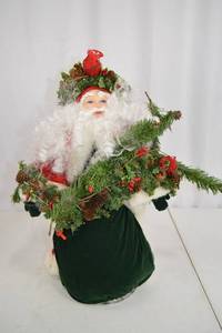 lot 44 image: Christmas Santa Decor Doll with Greenery and Cardinal