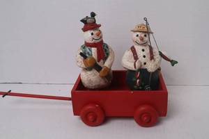 lot 3 image: Christmas Snowman Figurine Pair in Red Wagon Holiday Decor Set