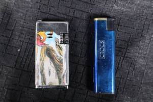 lot 135 image: Lighters - Scorch Graphic Novelty & Cross Blue Metal
