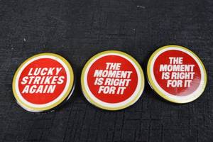 lot 193 image: Pin-Back Buttons - Lucky Strikes Again & The Moment Is Right For It