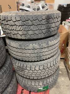lot 233 image: Set of 4 LT26570R17 Truck Tires with Chevy Center Caps
