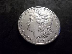 lot 15 image: 1887 S Morgan Silver Dollar