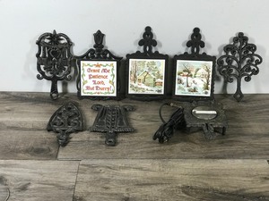 lot 301 image: Lot of Vintage Cast Iron Trivets and More