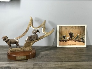 lot 272 image: Big Horn Sheep Carved From Moose Antler by Tony Ramer - Wimbledon, ND