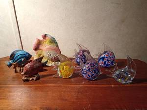 lot 93 image: Wood, glass, ceramic and sand fish figurines