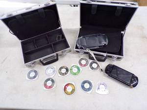 lot 18 image: PSP with Games and 2 Hard side Cases with power cord