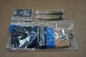 lot 54 image: Hold Fast Socks and Lucky Shot Bullet Bottle Openers and Valve Stem Covers