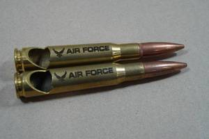 lot 233 image: 2 US Air Force 50 Cal Bottle Opener