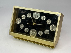lot 1 image: 12 Coin Silver Clock