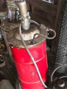 lot 68 image: Stewart Warner Barrel with Pump (red)