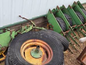 lot 73 image: Lot of (8) Corn Planter Parts and Wheels
