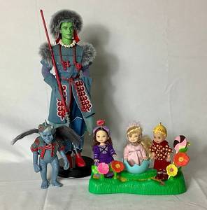 lot 50 image: Mattel Barbie the Wizard of Oz Munchkins and Winkie Guard Ken Doll with the Winged Monkey Figure