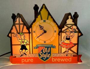 lot 22 image: Vintage Heilemans Old Style Lighted Chalet with Clock