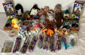 lot 46 image: Assorted Collection of Kids Toys - 10 Beanie Babies,  b  9 Toy Story Plush, 2 E.T. Bendable Toy, 7 Grave Diggers Lights & Lanyards and More