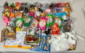 lot 42 image: McDonalds Happy Meal Plush Toys - 28 TY Plush, 2 Build A Bear and 10 The Dog plus 2 Garfiled Plush from Wendys Kids Meals