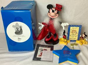 lot 62 image: Disney Mickey and Minnue Mouse Bundle - Bob Mackie Millennium Minnie,  Walts 100th Fantasia Ornaments, Mickey Sorcerer Snow Globe, Mickey Mouse NY Ornaments and Walts 100th 1928-2001 Photo Frame