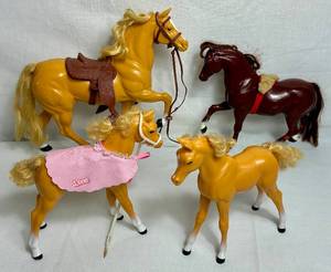 lot 73 image: Collection of Four Barbie Horses - Honey the Show Pony, Dallas Palomino Horse, Dream Horse Dixie Baby Palominos