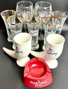 lot 142 image: Tuborg Beer Collection - Drinking Horn Steins, Gold Rimmed Beer Glasses, Plastic Ashtray and Goblets