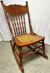lot 190 image: Cane Seat Antique Rocking Chair with North Wind Motif