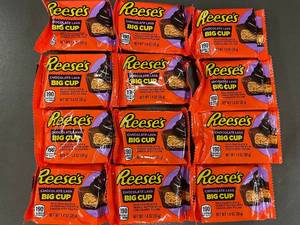 lot 141 image: Lot of 12 Reeses Chocolate Lava Big Cup 1.4 oz Bars, BB 052025