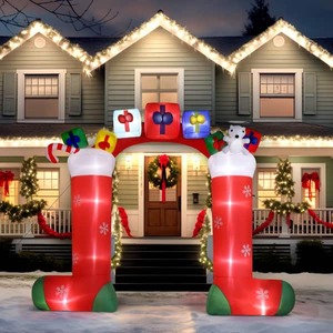 lot 102 image: Karl home 9 ft. x 10.9 ft. Sock Arch Christmas Inflatable with LED Lights